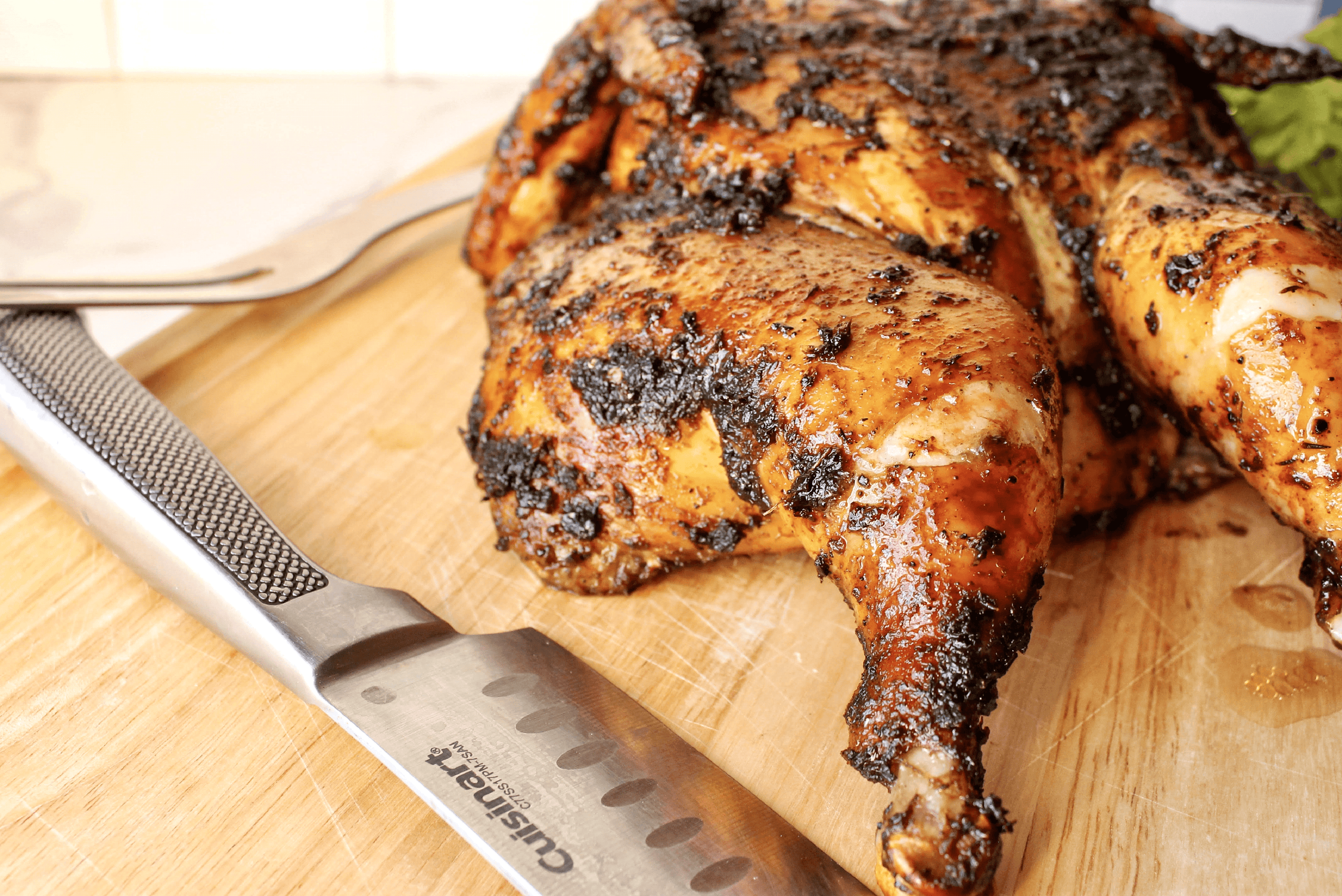 Whole spatchcock jerk chicken roasted until golden brown with crispy skin
